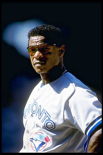 Dave Stewart and Rickey Henderson celebrate in the Blue Jays