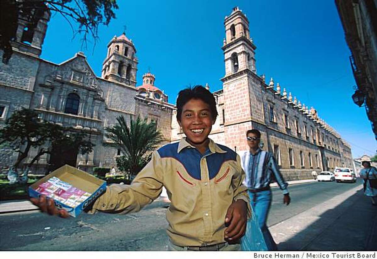 A boy sells candy on the streets of Morelia. The state capital is a candy-making center, with a market devoted to selling sweets.