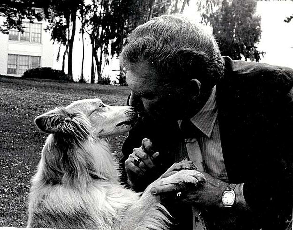 Richard Avanzino, then-President of the San Francisco SPCA, sharing a smooch with Sido, the dog whose life he fought to save.
