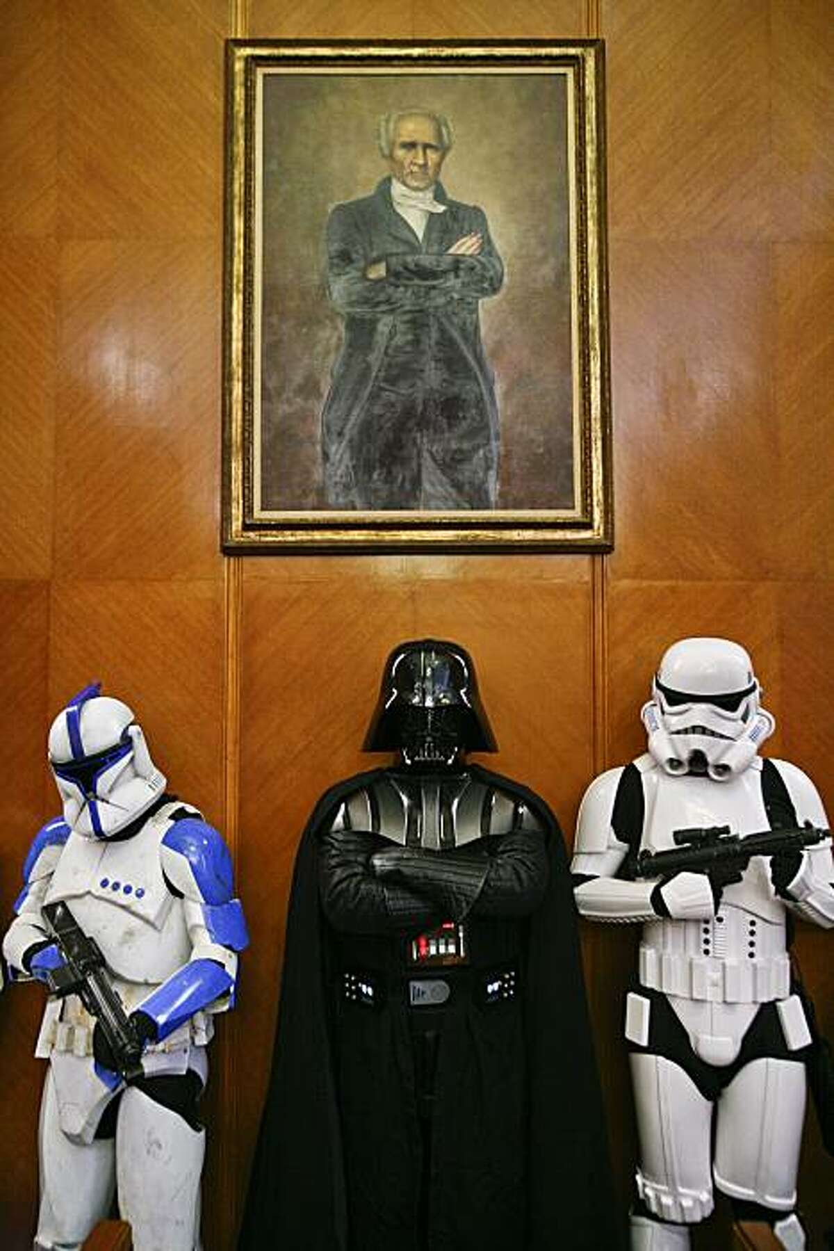 Members of the "501st Legion," an international group of Star Wars fans who own and wear realistic costumes from the movie saga, wait in Houston's City Council chamber before Mayor Annise Parker declared Tuesday, May 18, 2010, "Star Wars: The Clone Wars at Space Center Houston Day."