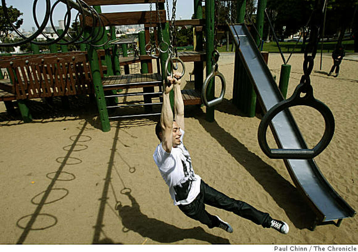 Josh Nielsen swings across the play structure at the Dolores Park playground in San Francisco, Calif., on Tuesday, March 31, 2009.