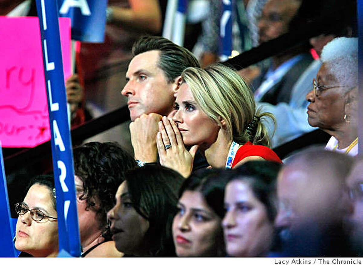 San Francisco Mayor Gavin Newsom and his wife Jennifer listen to Senator Hillary Clinton speak to the delegates, Tuesday Aug. 26,2008, at the Democratic National in Denver, Colorado.