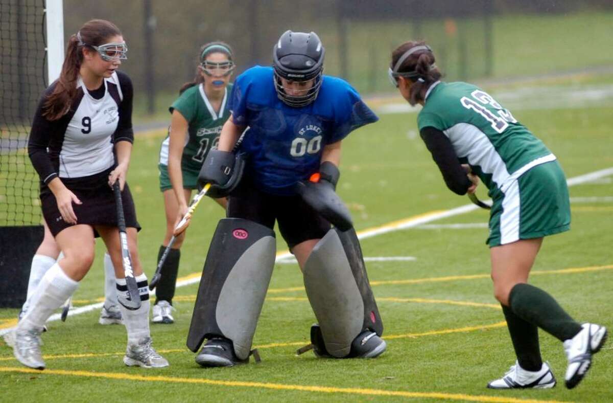 St. Lukes' goalie Catherine Simonson blocks a shot as the Convent of the Sacred Heart hosts St. Lukes in a field hockey match Tuesday afternoon, Oct. 27, 2009.