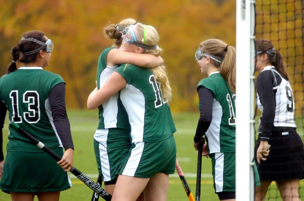 Sacred Heart's Lauren Church, center, is congratulalted by Tory Bensen after scoring Heart's first goal, Emily Hatton, left, and Tayler Sirabella, right, look on as the Convent of the Sacred Heart hosts St. Lukes in a field hockey match Tuesday afternoon, Oct. 27, 2009.