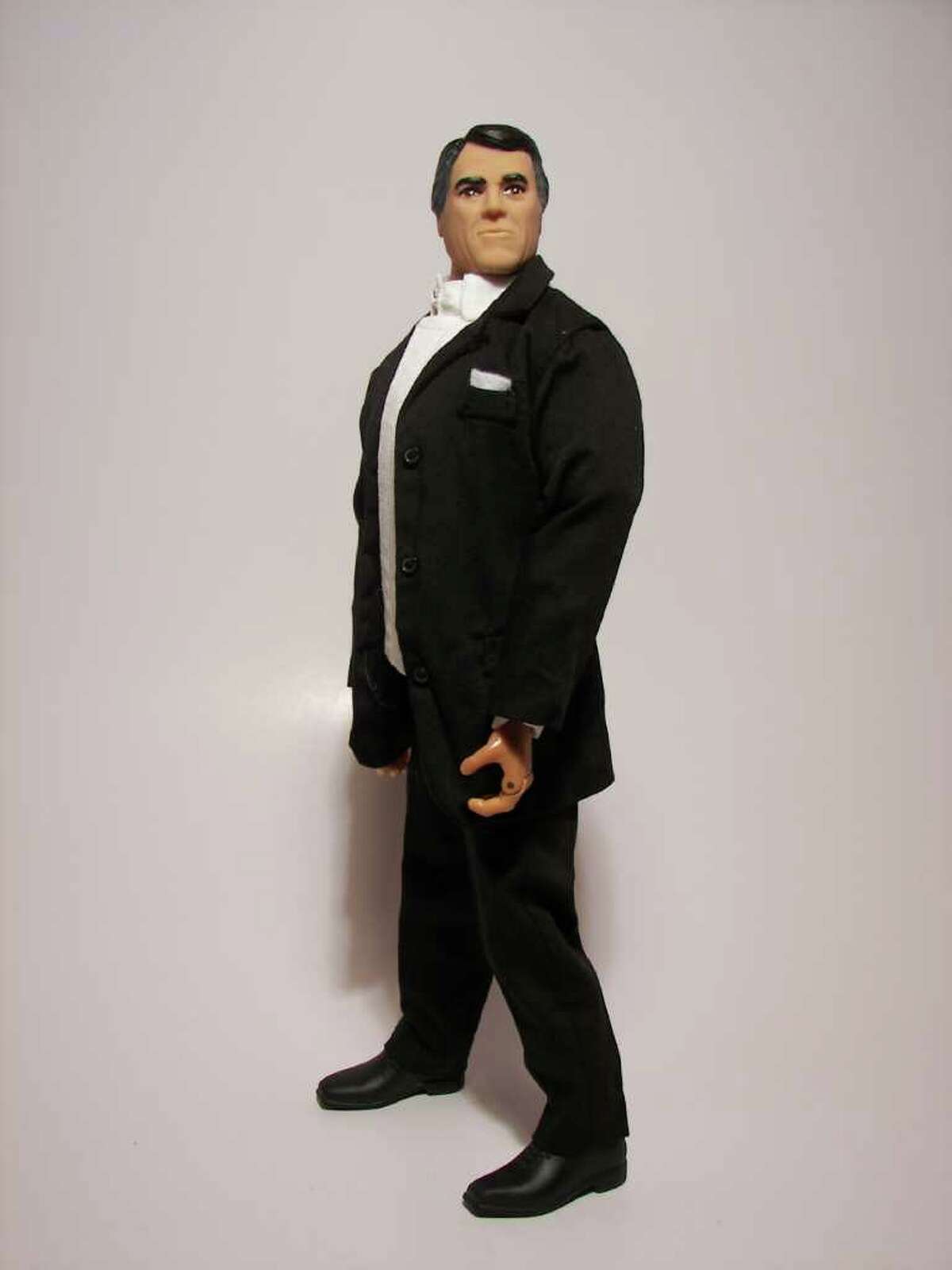 The Rick Perry action figure sports a suit.
