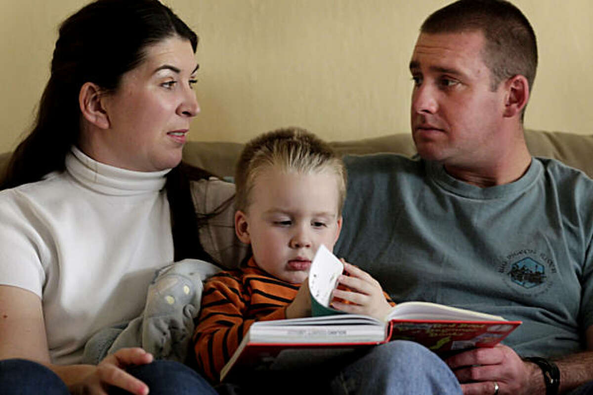 Danah and John Jewett talk among themselves as they read with their son 3 year old son Jayden at their home, Sunday Feb. 27, 2011, in Fairfield, Calif. The first son Dylan died in 2009 at the age of 5 of a brain tumor. They donated the tumor to Stanford scientists who have developed the first animal model of a type of brain cancer, diffuse intrinsic pontine glioma, that only affects young children and is almost always fatal.