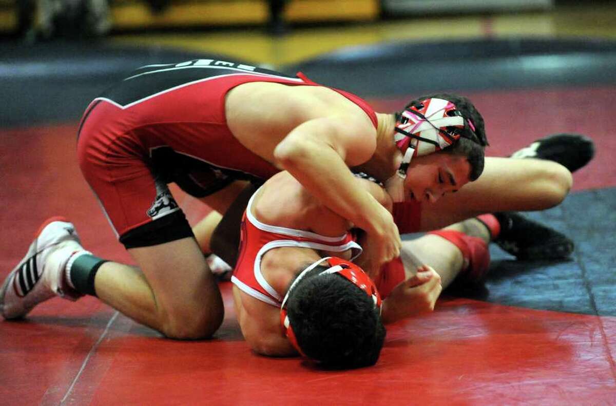 Fairfield Warde's Phil Neamonitis wrestles Greenwich's Cameron Gray, during boys wrestling action in Fairfield, Conn. on Wednesday January 11, 2012.