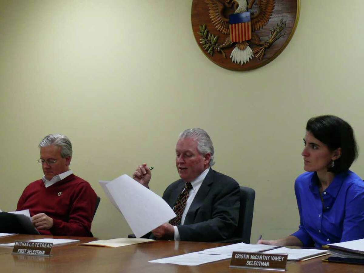 Board of Selectmen, from left, James Walsh, Michael Tetreau and Cristin McCarthy Vahey, on Wednesday discuss proposal to replace the incandescent fixtures on 109 street lamps with energy-saving and longer-burning LED fixtures.