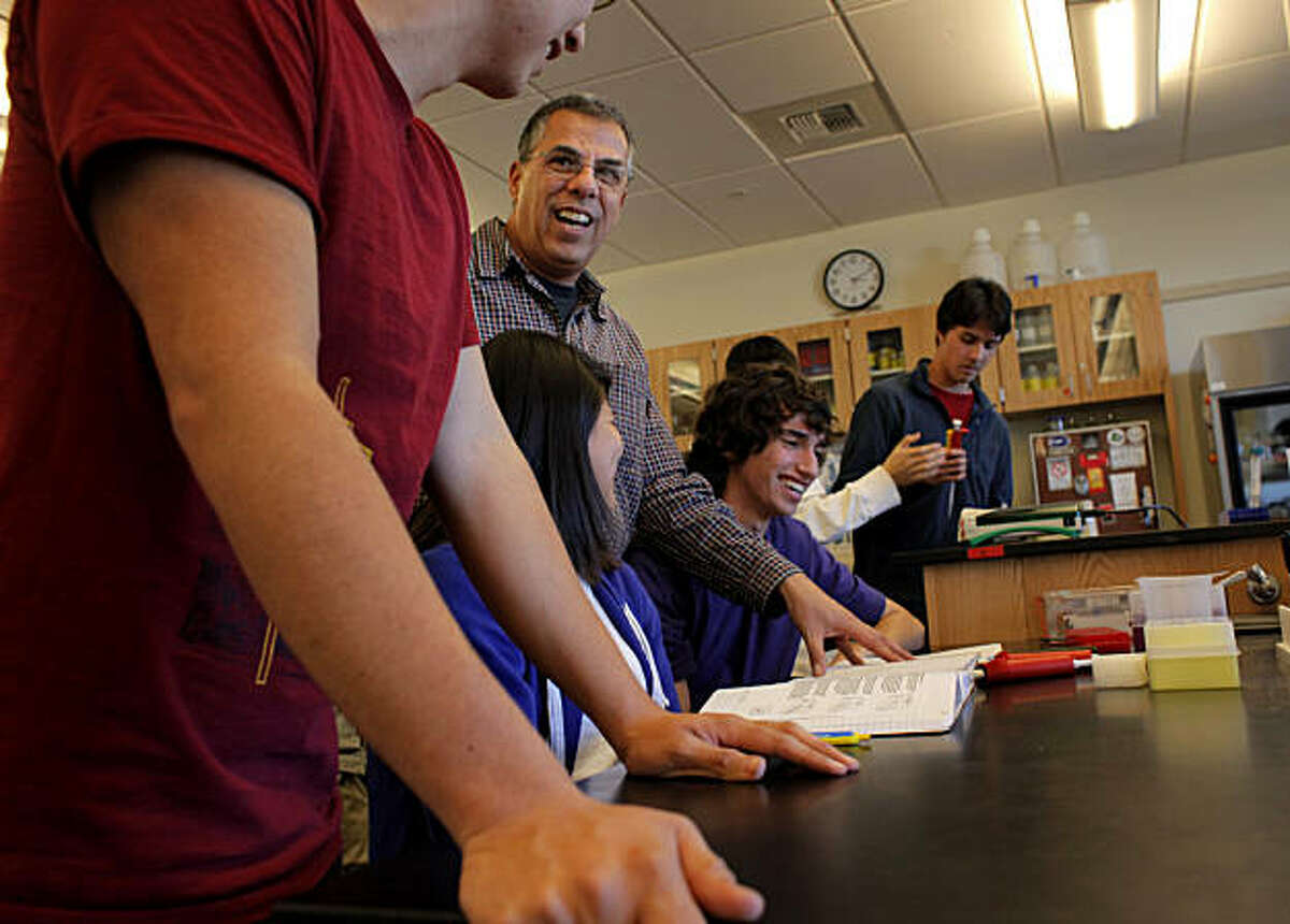 Teacher George Cachianes, center, instructs the seniors, Ricardo Mejia, left, Mary Roque and Mark Solovey, in the Biotech class at the Lincoln High School, Tuesday January 25, 2011, in San Francisco, Calif.