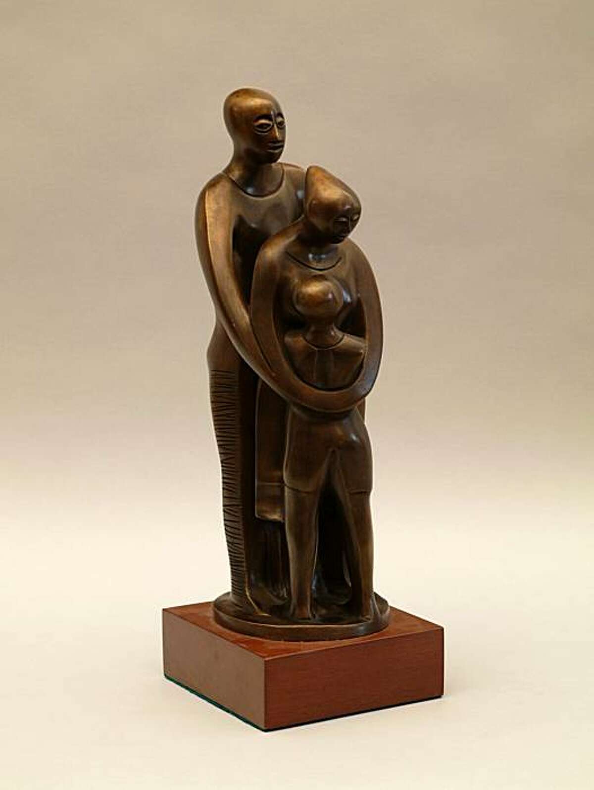 In this image released by Bronx Museum, Elizabeth Catlett's bronze statue "Family" is shown. The piece is part of the exhibition "Stargazers," on display at the Bronx Museum featuring works by Catlett and 21 contemporary artists. The show runs Jan. 27, 2011 through May 29.