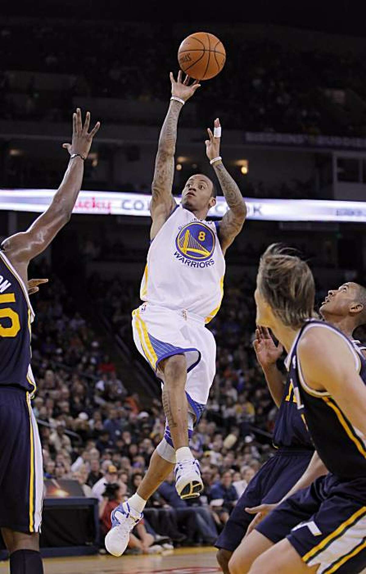 Monta Ellis puts up a shot in the first half. Ellis had no points for the first half against the Utah Jazz at Oracle Arena in Oakland on Sunday.