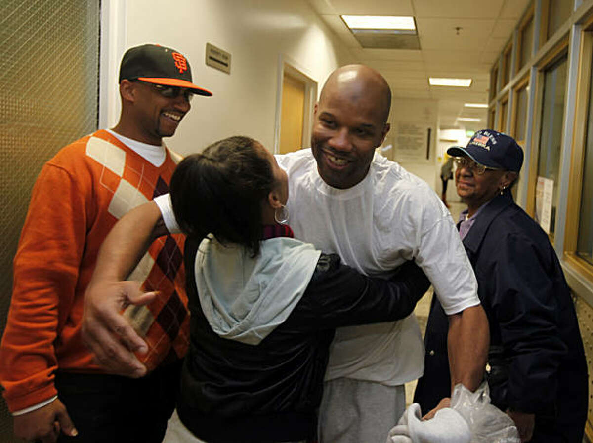 Family members hug Caramad Conley, who a judge said last month had been wrongfully convicted of a 1989 double murder in San Francisco. Conley walked out of San Francisco County jail Wednesday Jan 12, 2011 a free man. San Francisco's new DA George Gascon decided not to retry him.