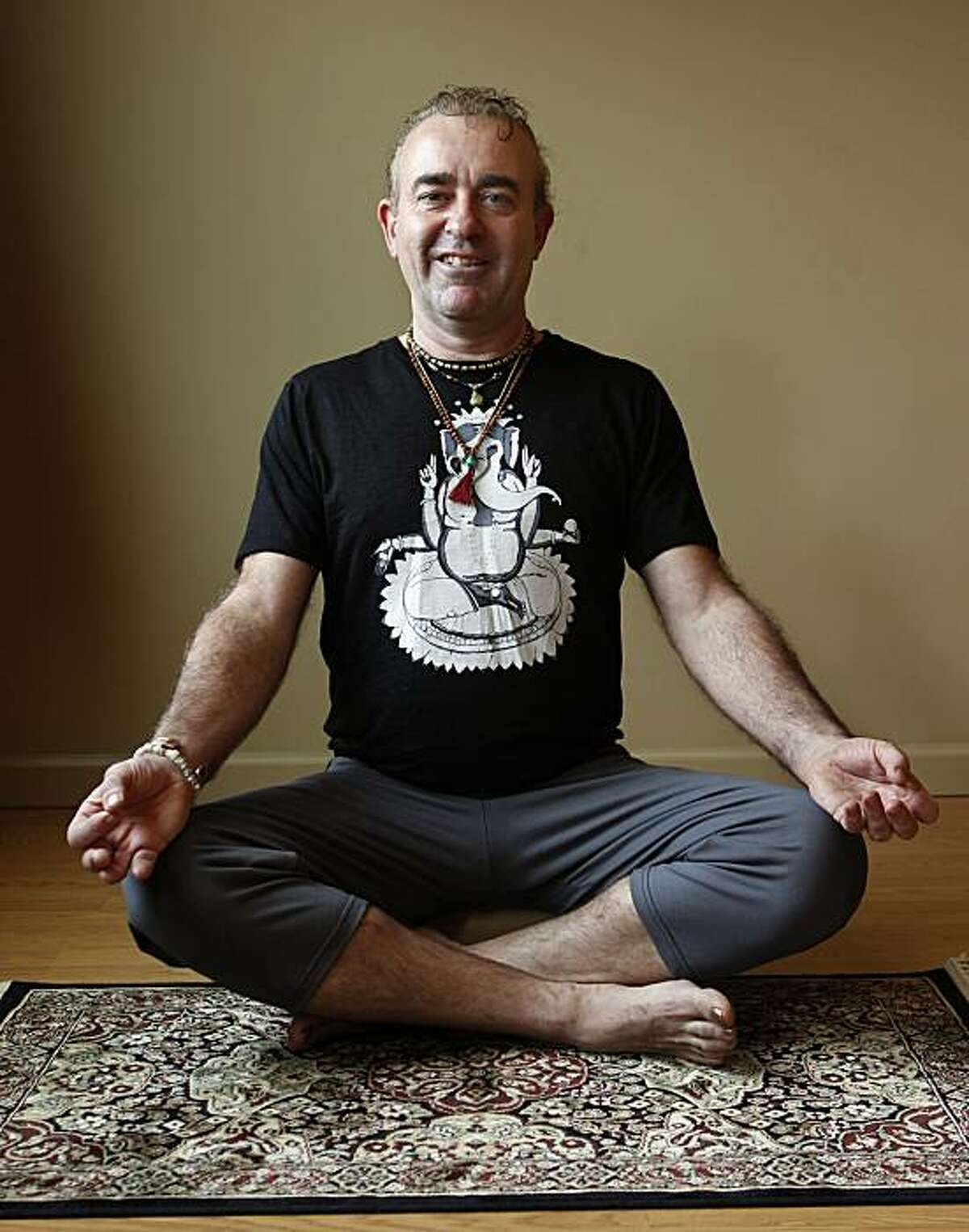 Tim Dale, founder of the Yoga Tree studio, strikes a yoga pose in San Francisco, Calif., on Friday, Dec. 10, 2010.