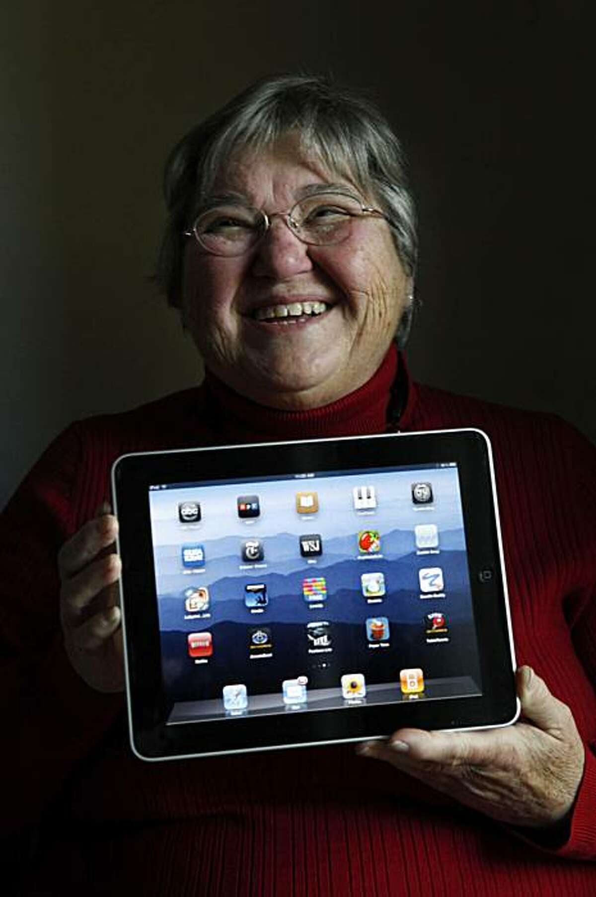 Rita Schena, 78, sits for a portrait with her new iPad at home on Thursday April 29, 2010 in Menlo Park, Calif. Schena said she is very excited to have this device and feels its perfect for seniors on the go.