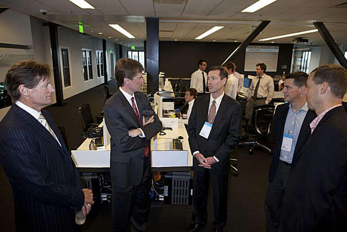 Ward Bushee, executive vice president and editor of the San Francisco Chronicle, Jeff Taylor, managing editor corporate enterprise and San Francisco bureau chief of Bloomberg News, Jeffrey Campbell, executive vice president and chief financial officer of McKesson Corp., James Larkin, director corporate public relations McKesson Corp. and Andy Burtis, vice president corporate marketing McKesson Corp., talk during the launch party celebrating the joining of Bloomberg News and the San Francisco Chronicle to produce a new daily business section in the Chronicle at Bloomberg's San Francisco bureau on June 22, 2010 in San Francisco, California. The collaboration, which will be renamed Business Report, The Chronicle with Bloomberg, will feature stories produced by both the Chronicle staff and Bloomberg News and is the first of it's kind in the United States. Photograph by David Paul Morris/Special to the Chronicle