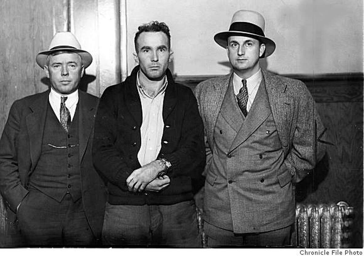 Sheriff William Emig (left), suspect Thomas Thurmond, and an unknown person are seen in this 1933 file photo.