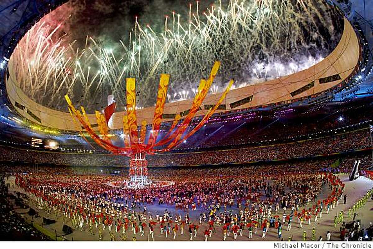 The National Stadium comes alive with fireworks and vibrant colors as closing ceremonies bring an end to the the 2008 Olympics in Beijing, China on Sunday Aug. 24, 2008.