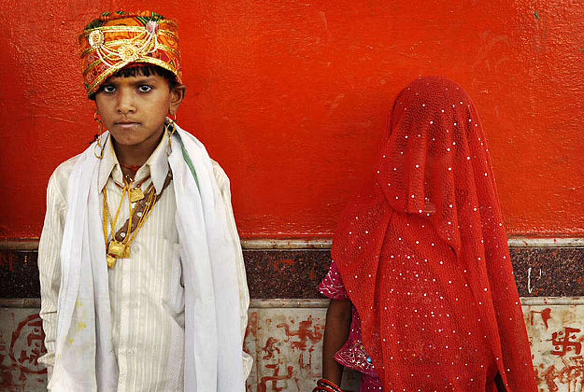 Mamta, 7, right, stands with her husband Santosh, 11, at a mass marriage at Chachoda village in Rajgarh town, about 155 kilometers (96 miles) from Bhopal, India, Sunday, May 16, 2010. Even though child marriages are illegal in India, they are still held particularly in small poverty stricken villages.
