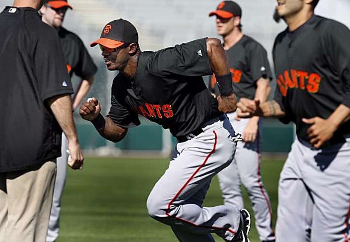 The Giants Fred Lewis takes off in a sprint during a morning workout Friday February 26, 2010 at Scottsdale Stadium. Scenes from the San Francisco Giants and Oakland Athletics spring training campaigns of 2010 in Scottsdale and Phoenix, Arizona.