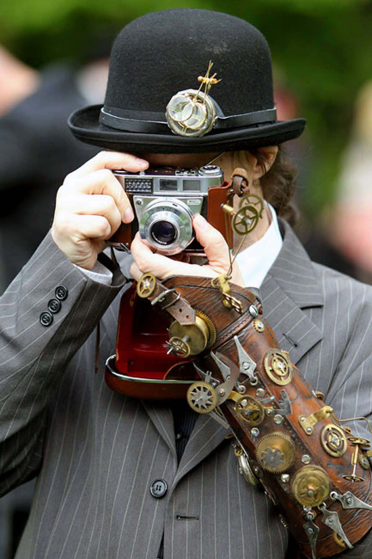A participant in an annual Wave-Gothic festival takes a photo on May 21, 2010 in Leipzig, eastern Germany, where more than 20 000 people are expected to attend the festival attracting the friends of gothic romanticism. The festival offers a very special spectacle with a range of concerts, historical markets, theatre and cinema, gothic scene performances, exhibitions, readings and parties.