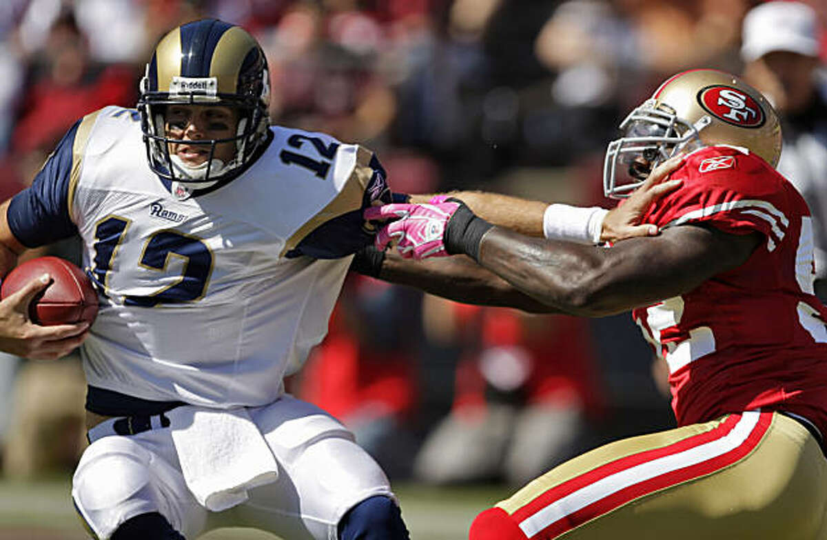 The Rams' Kyle Boller is sacked by 49ers linebacker Patrick Willis in the first quarter at Candlestick Park in San Francisco on Sunday.