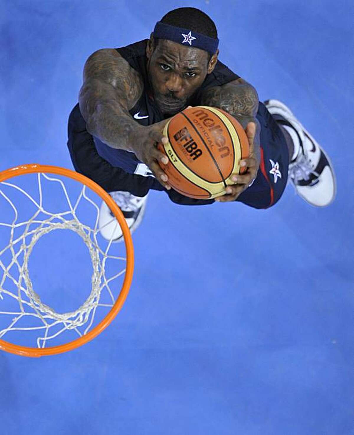 USA's LeBron James goes for a dunk during the men's basketball gold medal match Spain against The US of the Beijing 2008 Olympic Games on August 24, 2008 at the Olympic basketball Arena in Beijing. The United States won the Olympic men's basketball gold medal defeating Spain 118-107. Argentina defeated Lithuania 87-75 in the bronze-medal game. AFP PHOTO / FILIPPO MONTEFORTE (Photo credit should read FILIPPO MONTEFORTE/AFP/Getty Images)