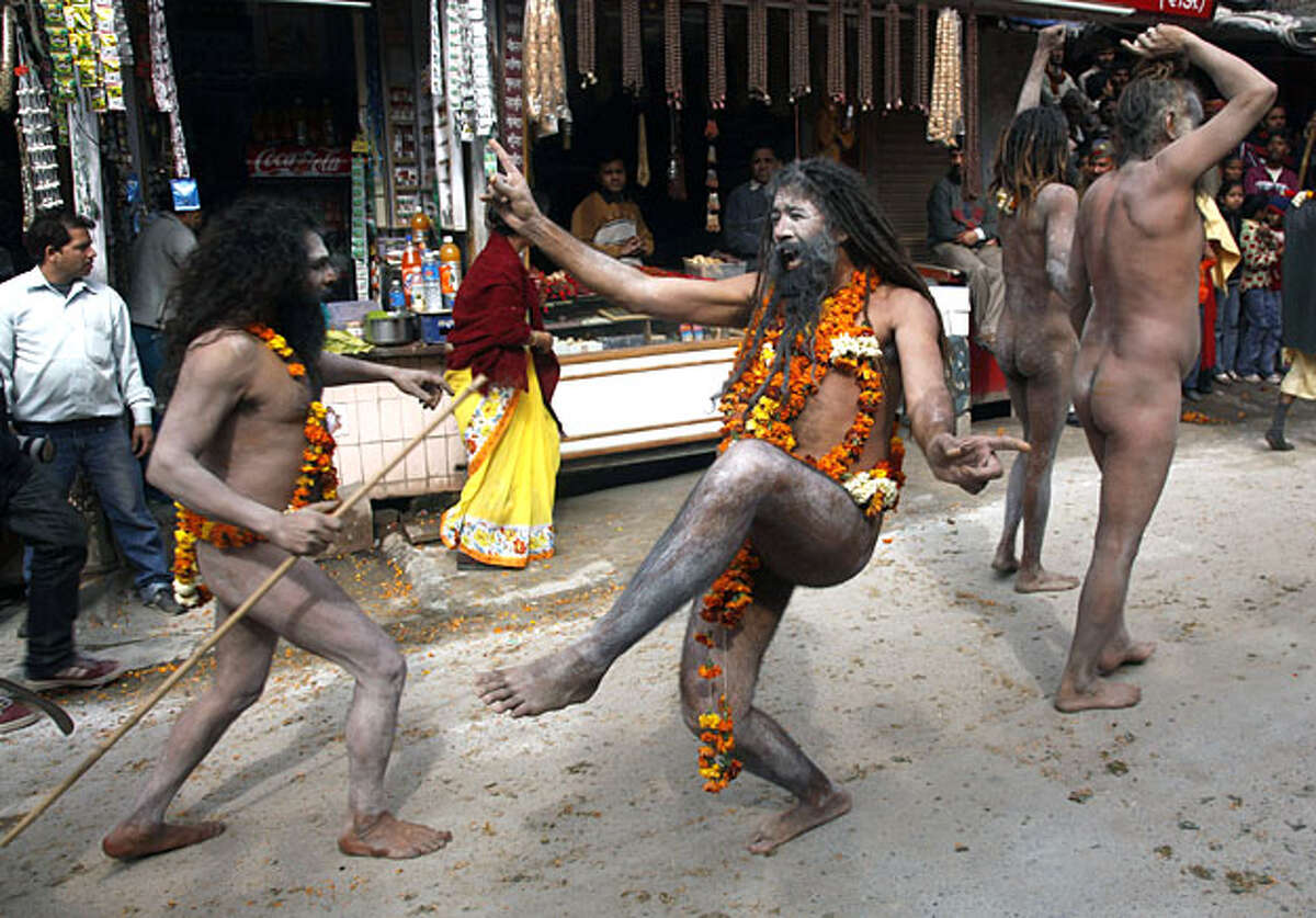 Naga Sadhus, or Hindu holy men, march in a religious procession after taking holy dips first Shahi Snan, or royal bath, in the river Ganges during the Kumbh Fair in Haridwar, India, Friday, Feb. 12, 2010. Thousands of devotees tookdips in the chilly waters of the Ganges river in one of northern India's holiest cities early Friday, one of the most auspicious days of a months-long Hindu festival expected to attract more than 10 million people.