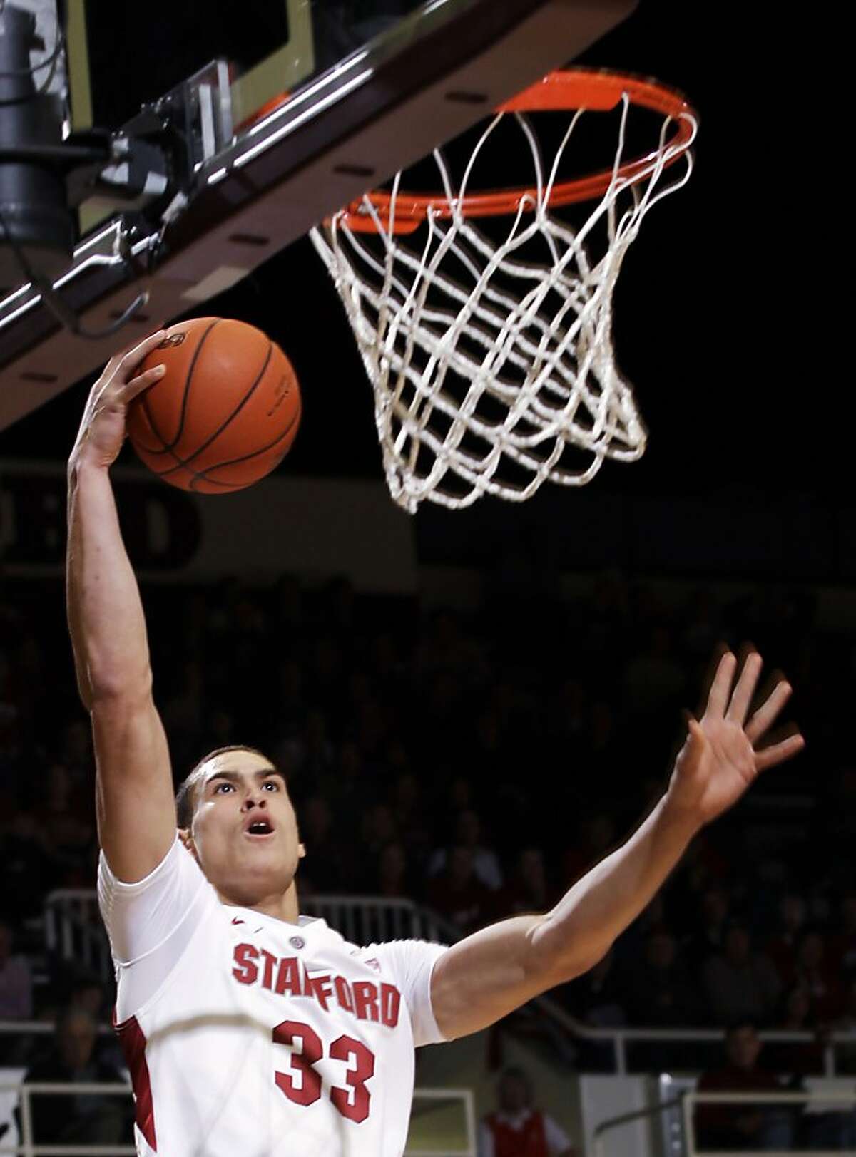 Stanford forward Dwight Powell (33) dunks the ball against Utah in the first half of an NCAA college basketball game in Stanford, Calif., Thursday, Jan. 12, 2012. (AP Photo/Paul Sakuma)