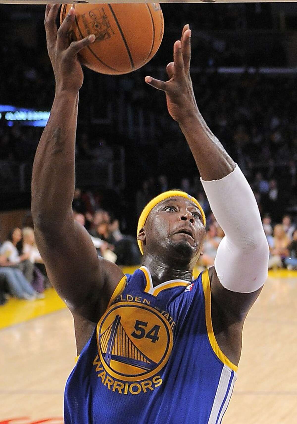 Golden State Warriors center Kwame Brown puts up a shot during the first half of their NBA basketball game against the Los Angeles Lakers, Friday, Jan. 6, 2012, in Los Angeles.