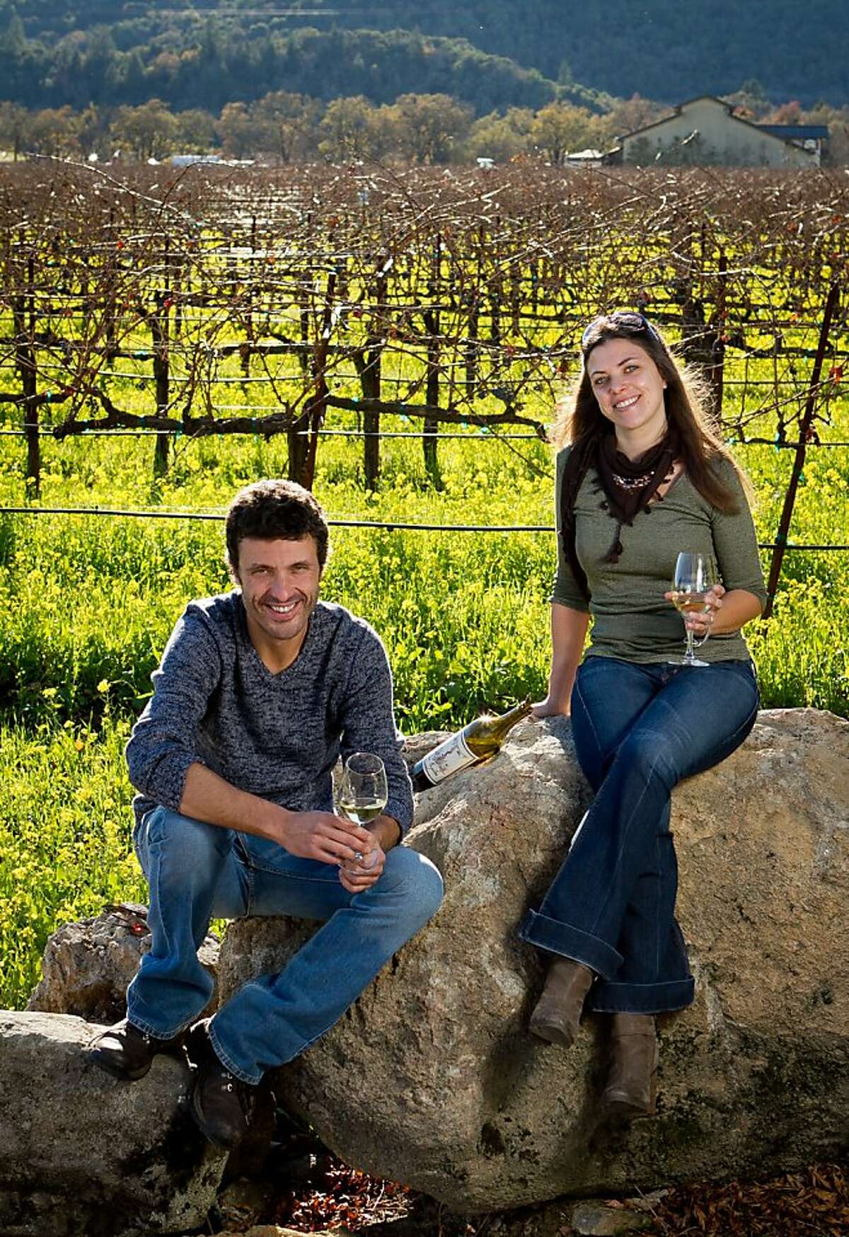 Letizia Pauletto and Enrico Bertoz of Arbe Garbe Winery with their wine in a vineyard next to their home in Rutherford, Calif., on Friday, December 16th, 2011.