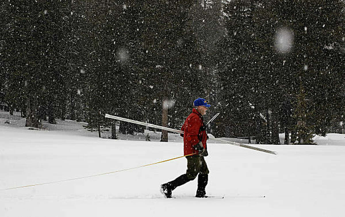 Frank Gehrke of the California Department of Water Resources conducts the first snow survey of the winter season at Phillips Station on Tuesday.
