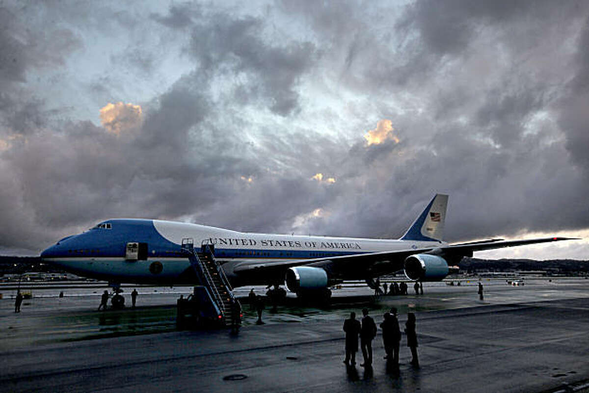 Air Force One sits on the tarmac under partly cloudy skies as the rain took a brief break for the Preident's arrival. President Barack Obama arrived at San Francisco International airport, on Thursday Feb. 17, 2011, for a one day visit with local business leaders in the fields of technology and innovation.