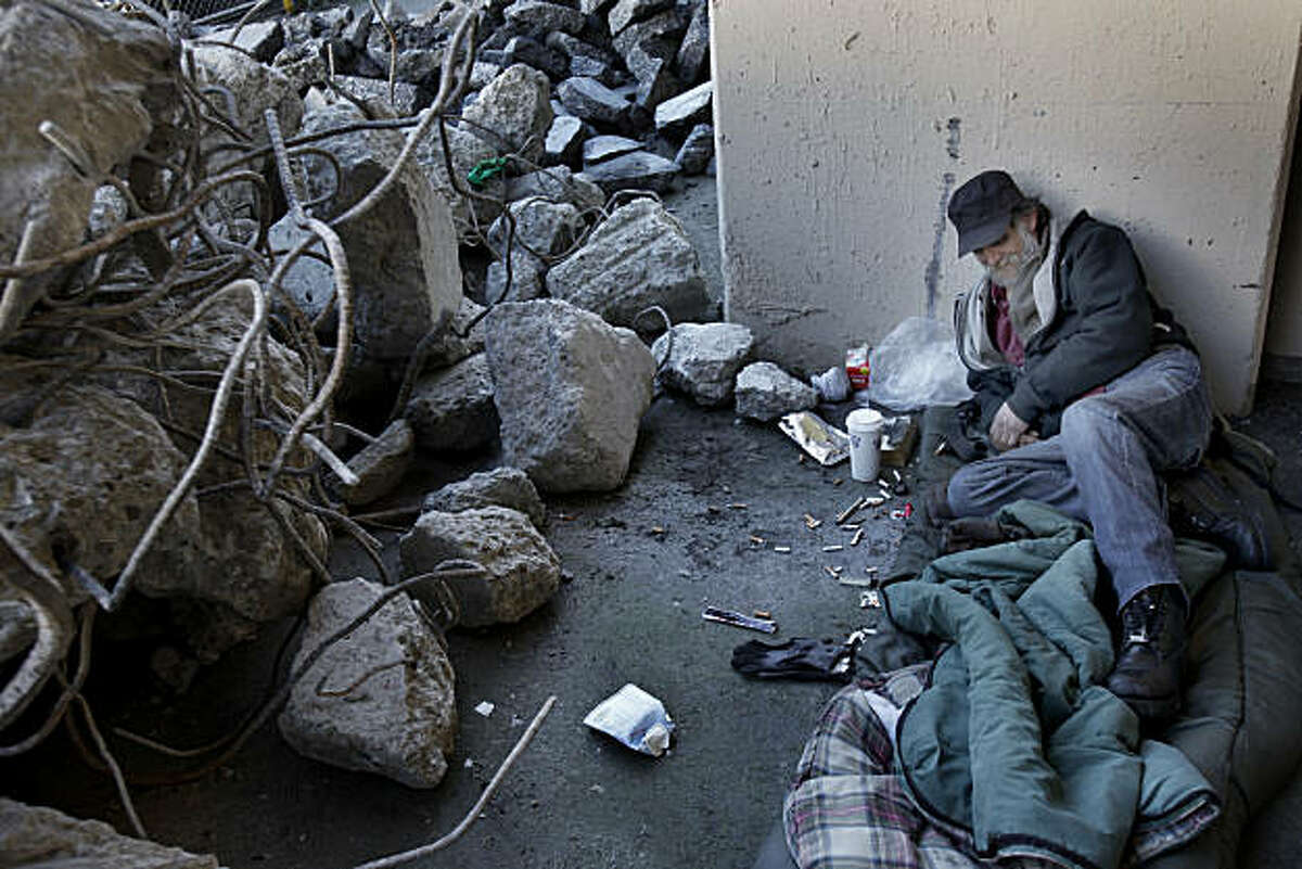 Michael, a homeless man who used to live in the shadow of the Transbay Terminal, now sleeps near the rubble created by the demolition Wednesday February 9, 2011. It has been six months since San Francisco, Calif., city officials cleared out a large congregation of homeless people from the Transbay Terminal at First and Mission Streets.