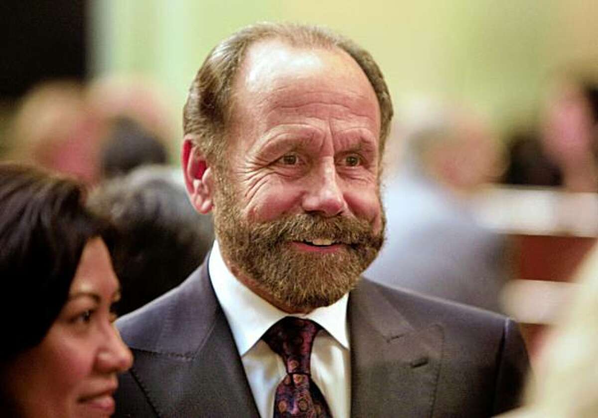 Jerry Hill (D) of San Mateo who was newly elected to California Assembly talks to friends before taking the oath of office in the Assembly Chambers at the State Capitol Building in Sacramento, Calif., on December 1, 2008.