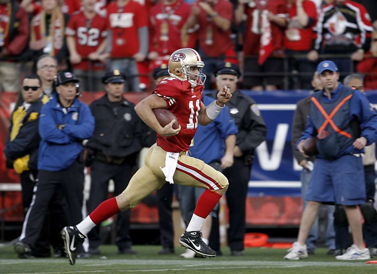 49ers Alex Smith sprints to the endzone on his fourth quarter touchdown run, as the San Francisco 49ers go on to beat the New Orleans Saints 36-32, in the NFC divisional playoffs, on Saturday Jan. 14, 2012, in San Francisco, Ca.
