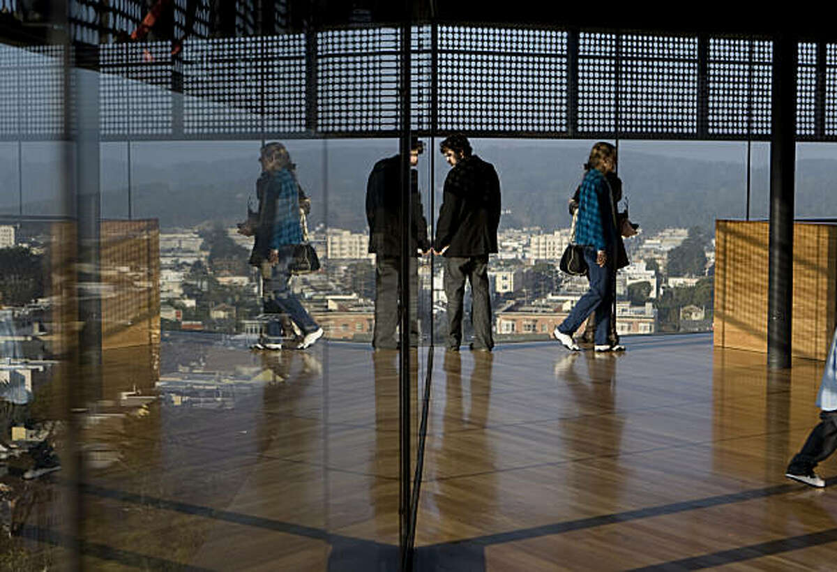 Visitors get a view from the De Young Museum's tower observation deck in San Francisco Calif., on Friday, Jan. 8, 2010.