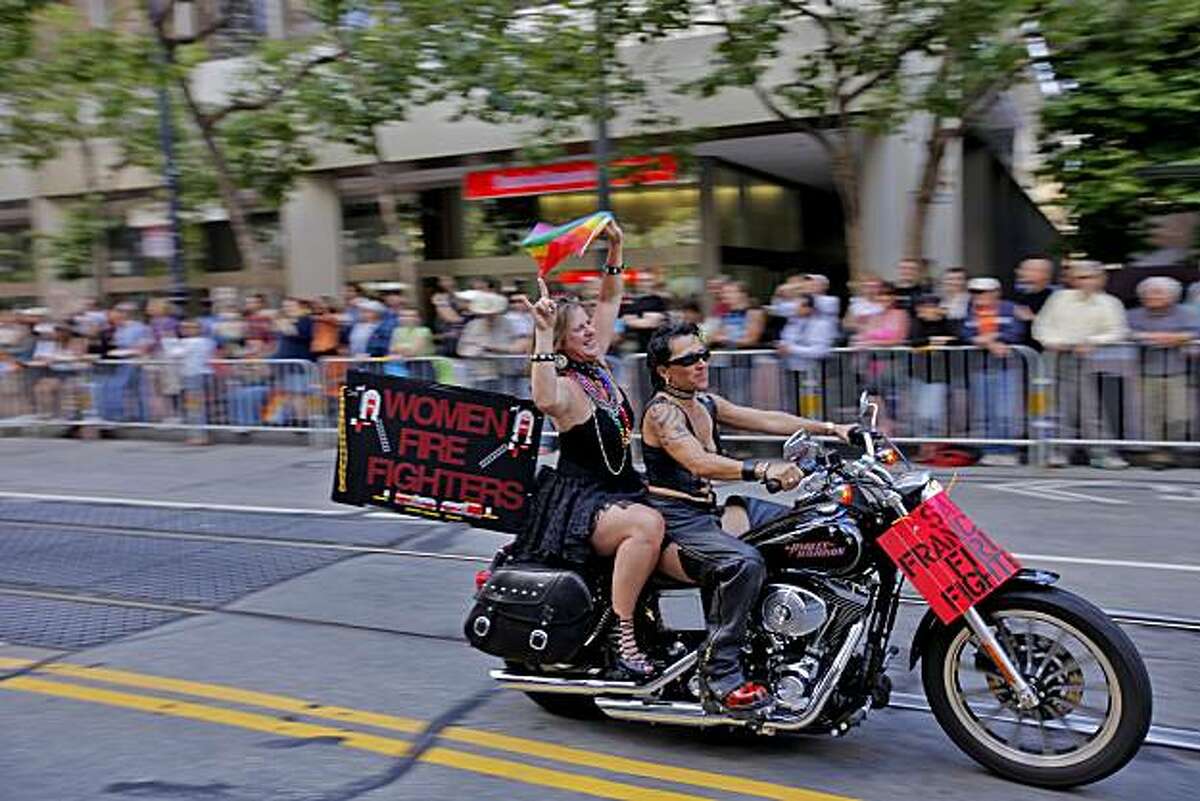The crowd cheers as Dykes on Bikes leads the 40th annual Gay Pride Parade down Market Street on Sunday in San Francisco.