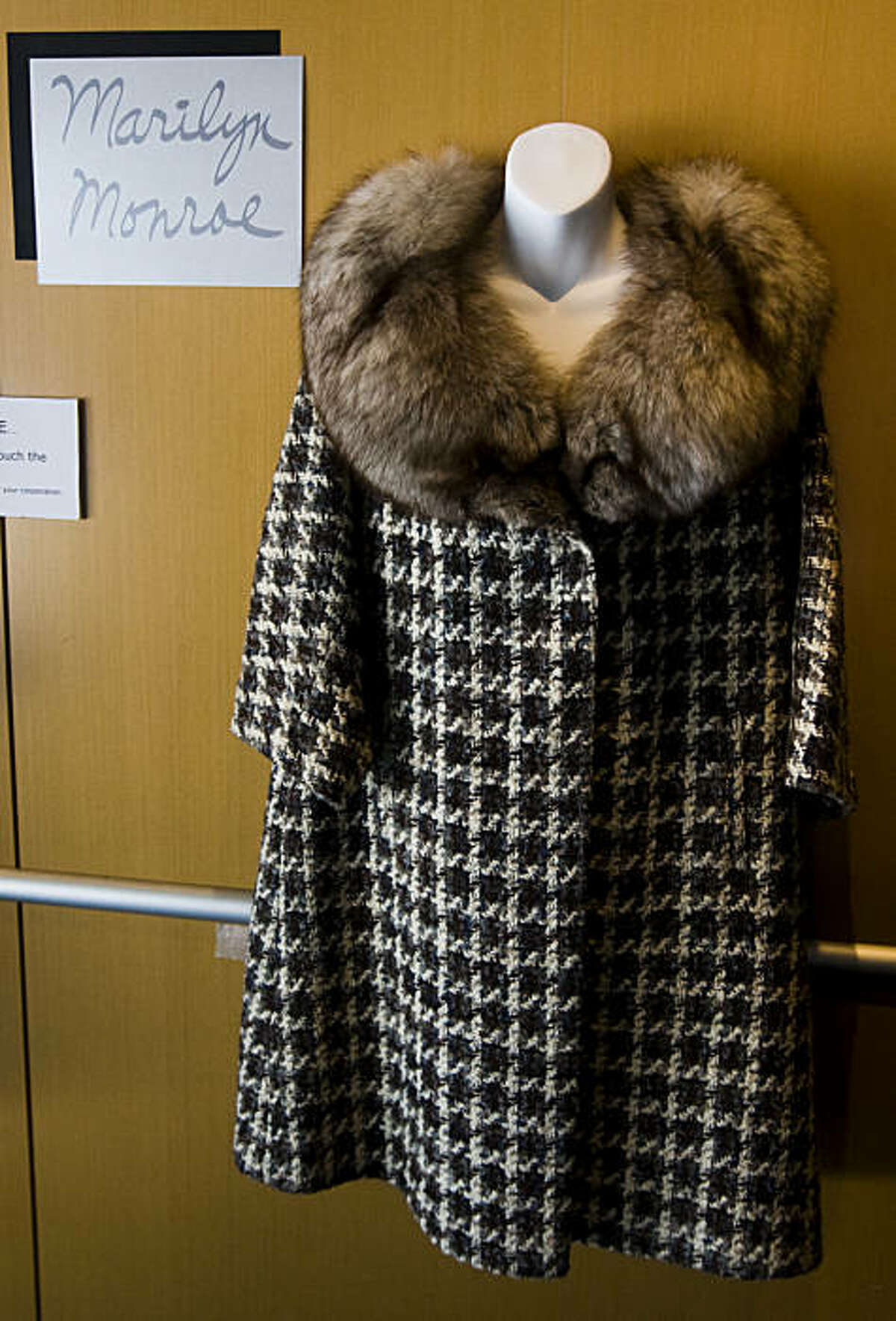 A coat worn by Marilyn Monroe hangs on display in the Metreon. Memorabilia from TV and movie stars is on display on the ground floor of the Metreon in San Francisco. The items are part of the "Hollywood Legends: The Barry Barsamian Collection" exhibit and will be on display until the end of May.