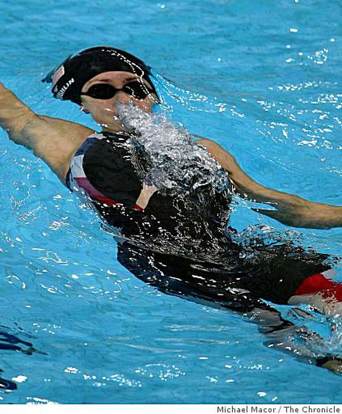 USA's Natalie Coughlin swims the semi-finals in the 100 meter backstroke to advance, during the 2008 Olympic Games, Monday Aug. 11, 2008 in Beijing, China.