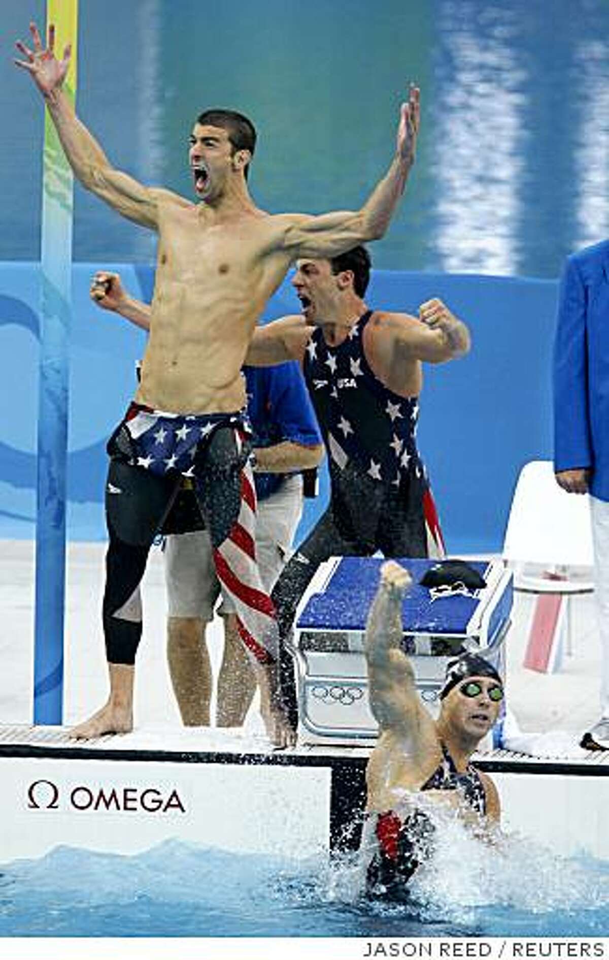 (L-R) Michael Phelps, Garrett Weber-Gale and Jason Lezak of the U.S. celebrate after winning the men's 4x100m freestyle relay swimming final at the National Aquatics Center during the Beijing 2008 Olympic Games August 11, 2008. REUTERS/Jason Reed (CHINA)