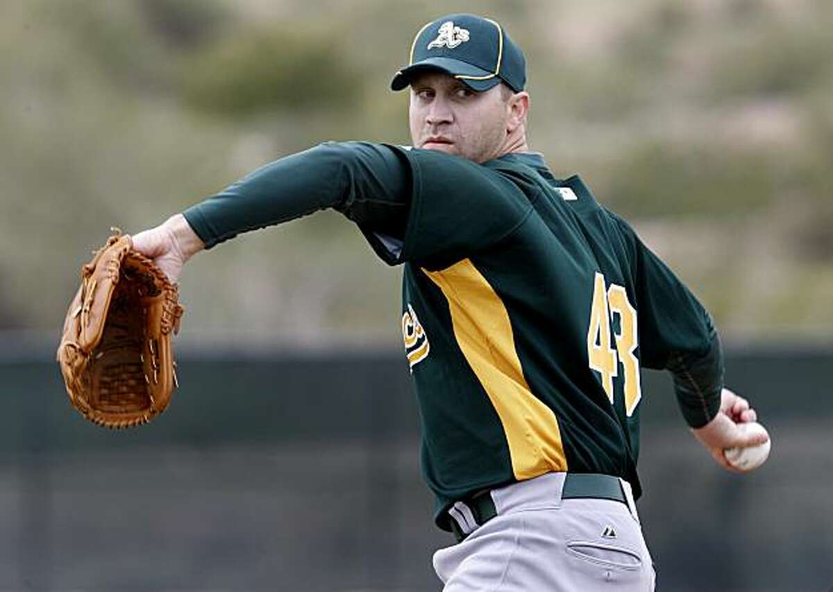A's pitcher Michael Wuertz threw batting practice Saturday February 27, 2010. Annual spring training action with the San Francisco Giants and Oakland Athletics from Scottsdale and Phoenix, Arizona.