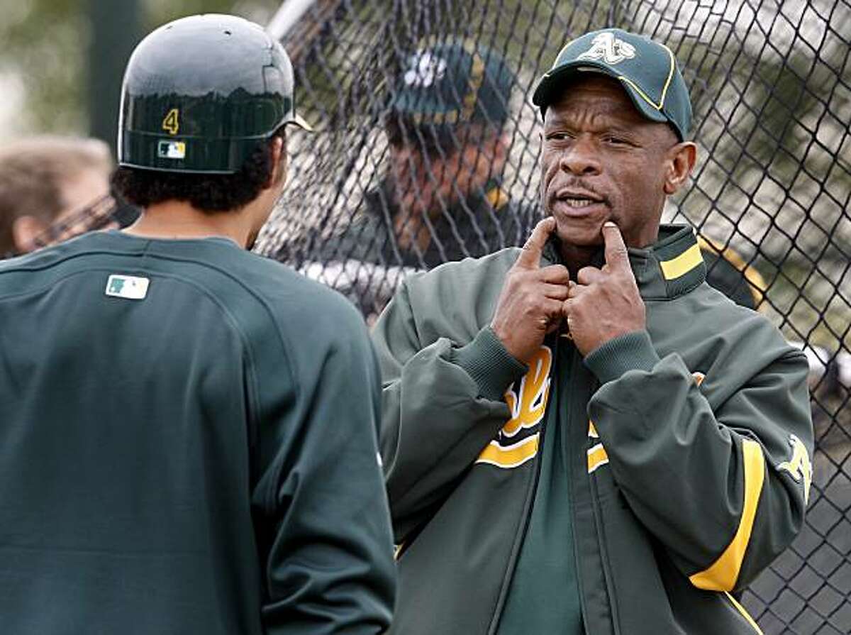 Former Oakland A's star and Hall of Famer Rickey Henderson talked to Coco Crisp around the batting cage Saturday February 27, 2010. Annual spring training action with the San Francisco Giants and Oakland Athletics from Scottsdale and Phoenix, Arizona.