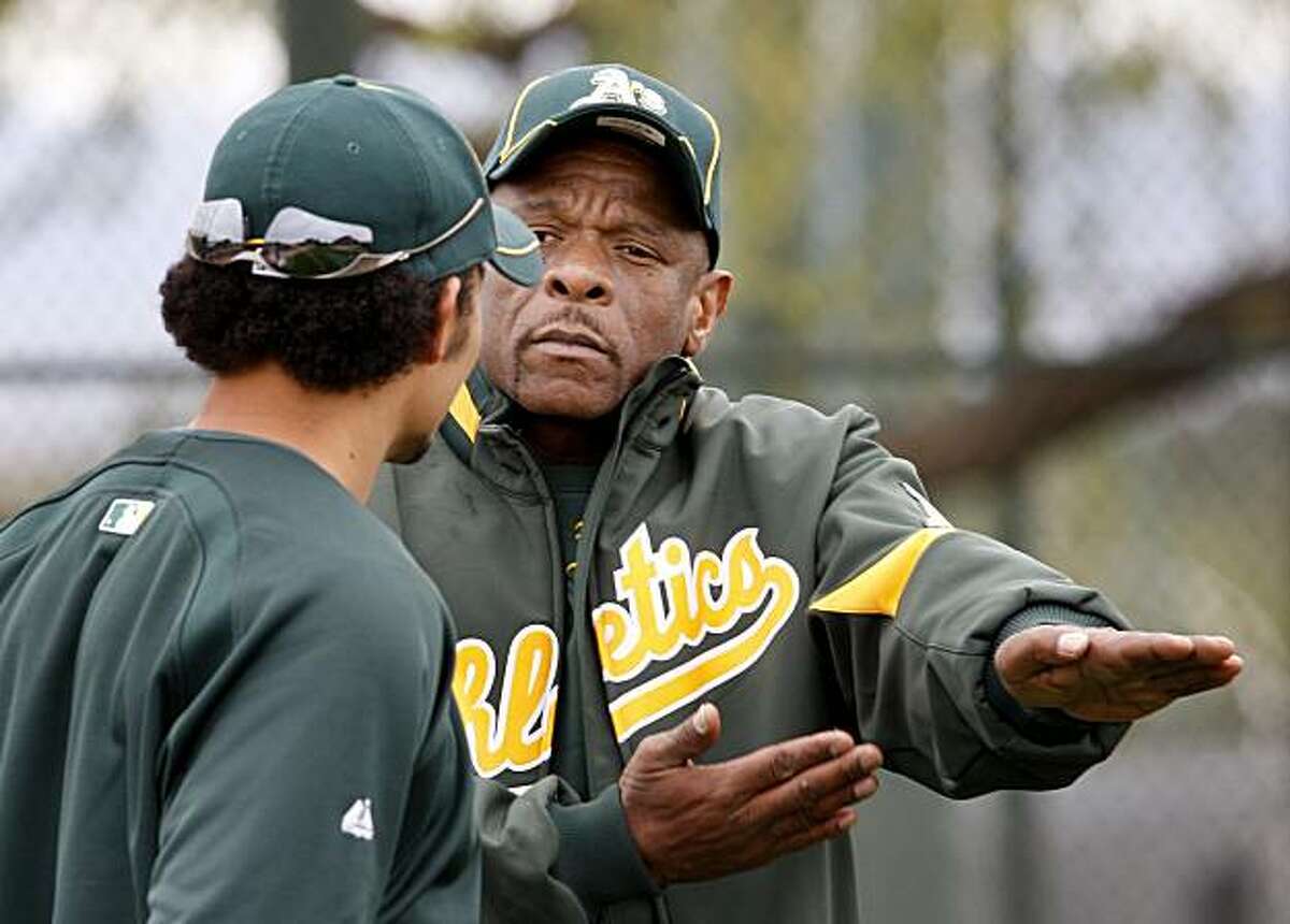 Rickey Henderson (right) longtime star Oakland A's player talked to Coco Crisp about his slide Saturday February 27, 2010. Annual spring training action with the San Francisco Giants and Oakland Athletics from Scottsdale and Phoenix, Arizona.