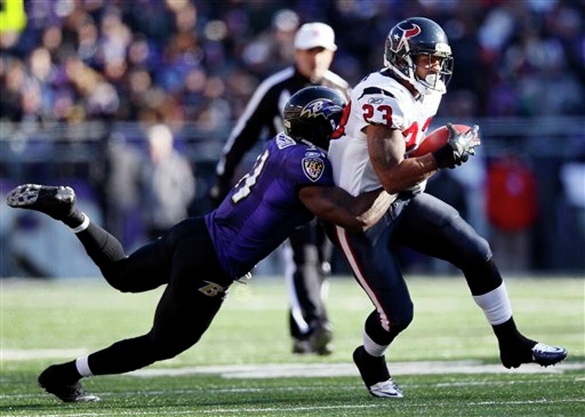 Baltimore Ravens strong safety Bernard Pollard, left, stops Houston Texans running back Arian Foster during the first half of an NFL divisional playoff football game in Baltimore, Sunday, Jan. 15, 2012. (AP Photo/Patrick Semansky)