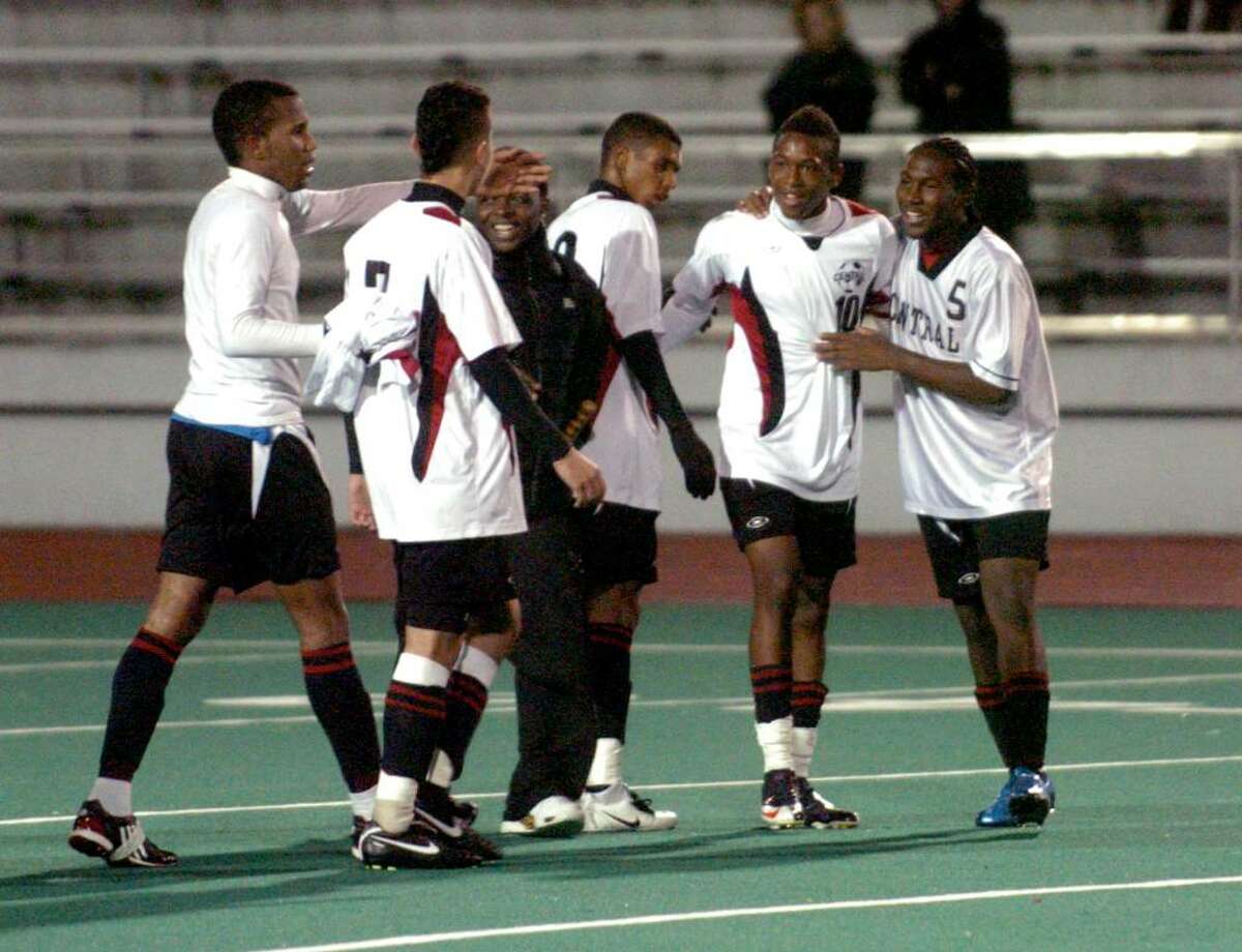 Central teammates surround #10 Reco McLauren, second from right, after they defeated Staples in FCIAC soccer action in Bridgeport, Conn. on Wednesday Oct. 28, 2009. McLauren scored both of the teams goals.