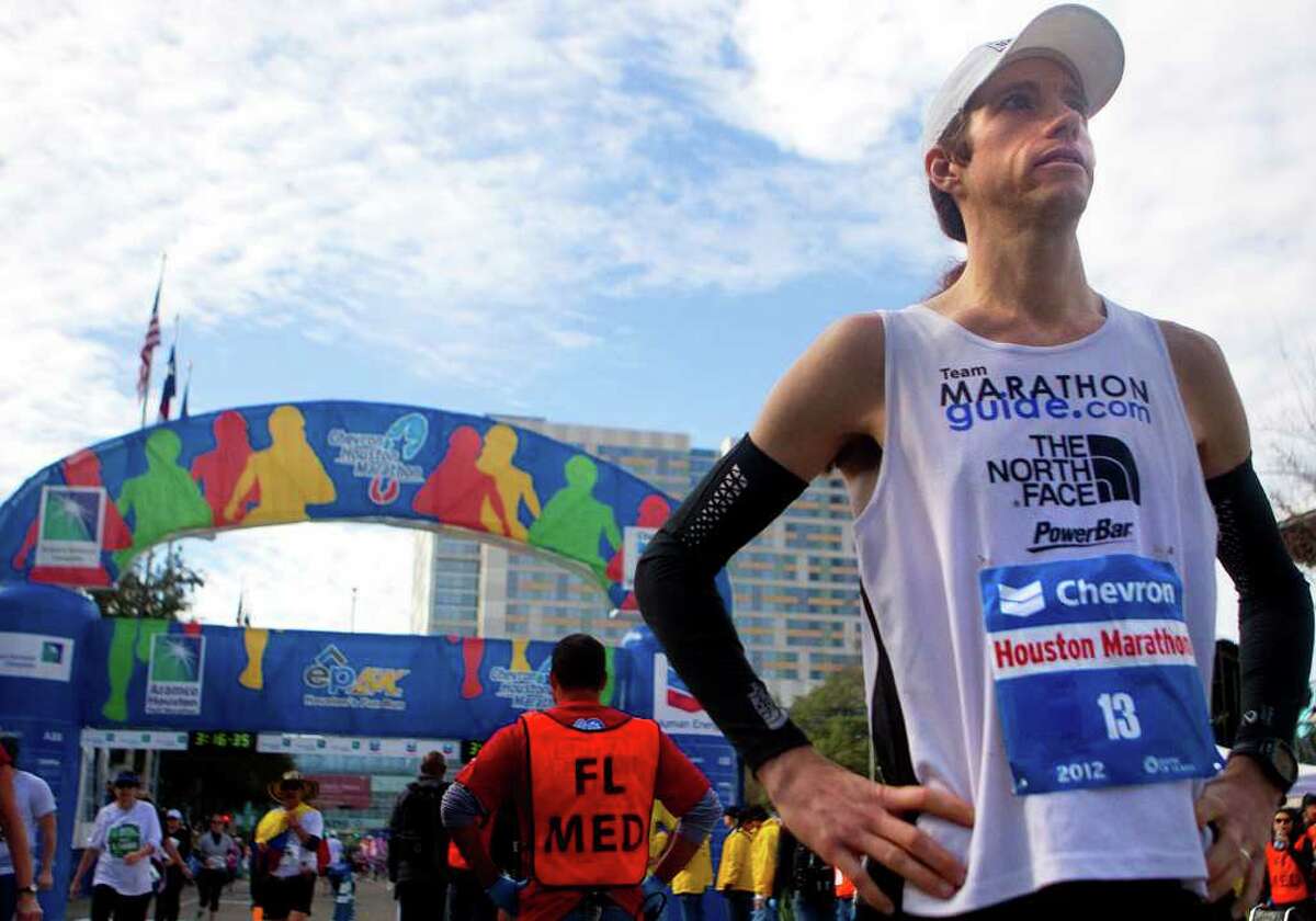 Mike Wardian catches his breath after finishing his second marathon in two days Sunday.
