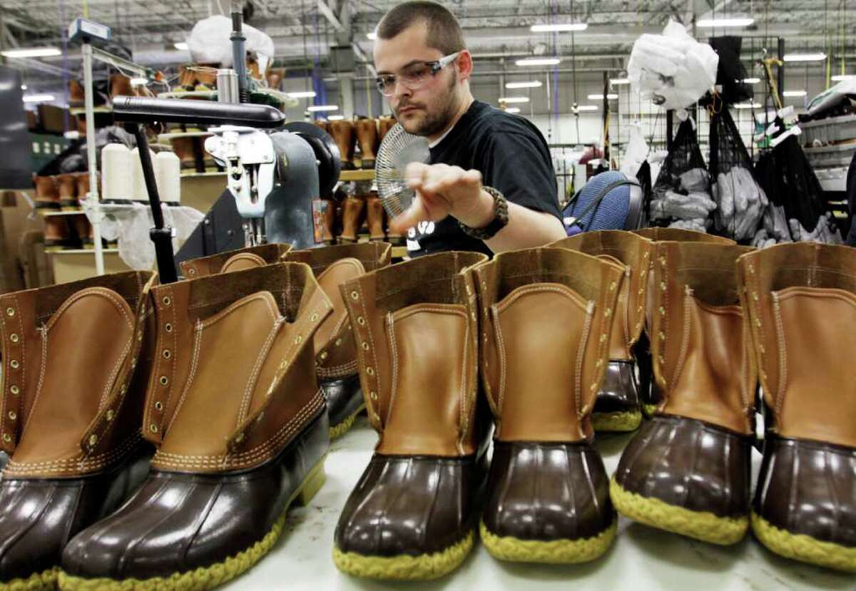 In this Dec. 14, 2011 photo, Eric Rego, of E. Boothbay, Maine, stitches boots in the facility where L.L. Bean boots are assembled in Brunswick, Maine. L.L. Bean's famed hunting boots are seeing a surge in popularity, necessitating the hiring of more than 100 additional employees to make them.