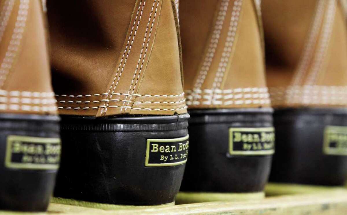 In this Dec. 14, 2011 photo, pairs of boots are seen in the facility where L.L. Bean boots are assembled in Brunswick, Maine. L.L. Bean's famed hunting boots are seeing a surge in popularity, necessitating the hiring of more than 100 additional employees to make them.