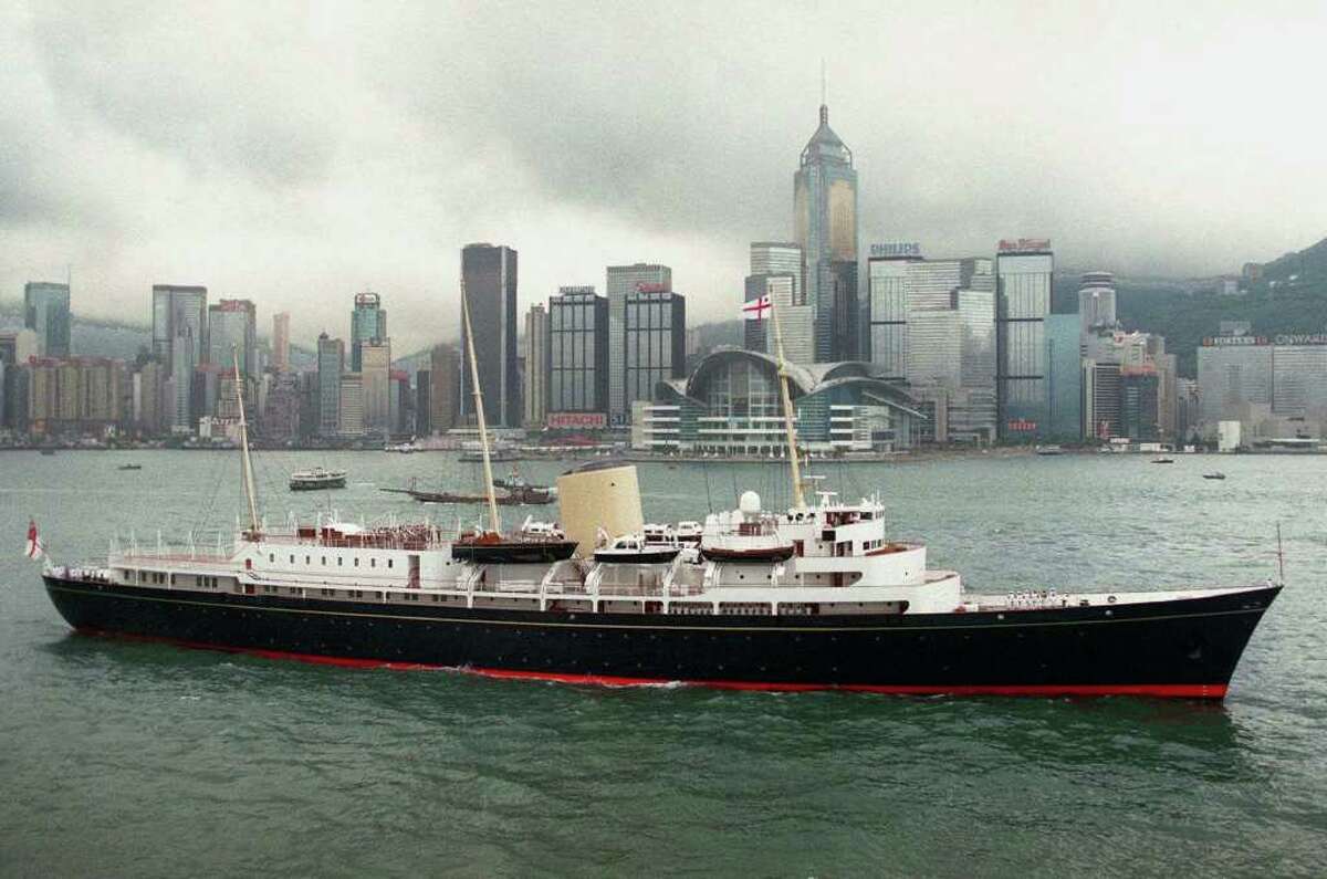 FILE - A June 23, 1997 photo from files showing the Royal Yacht Britannia passing the new Hong Kong Convention Center in Hong Kong Harbor. What do you get for a monarch who has almost everything? Not, apparently, a new yacht, at least not one paid for with taxpayer funds. That was the message Monday, Jan. 16, 2012, as a brief boomlet of support for the idea of providing Queen Elizabeth II with a new royal yacht to mark her Diamond Jubilee was quickly deflated by Prime Minister David Cameron. It is estimated that a new yacht would cost at least 60 million pounds ($92 million/72,455,000 euro). Cameron's spokesman Steve Field said it would not be appropriate for public funds to be spent on a new yacht during times of economic hardship. (AP Photo/Pool, File)