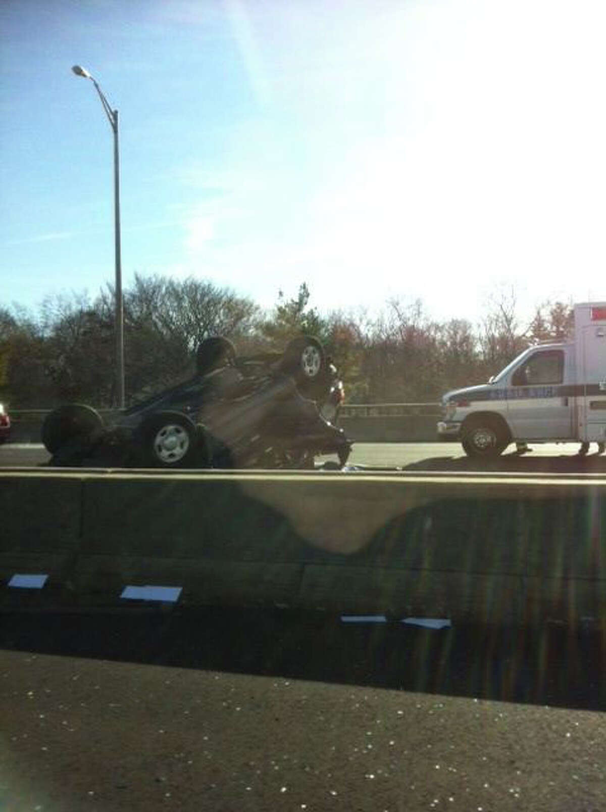 A photo sent to WTNH via ReportIt shows a car that rolled over on I-95 in Greenwich on Monday, January 16, 2011.